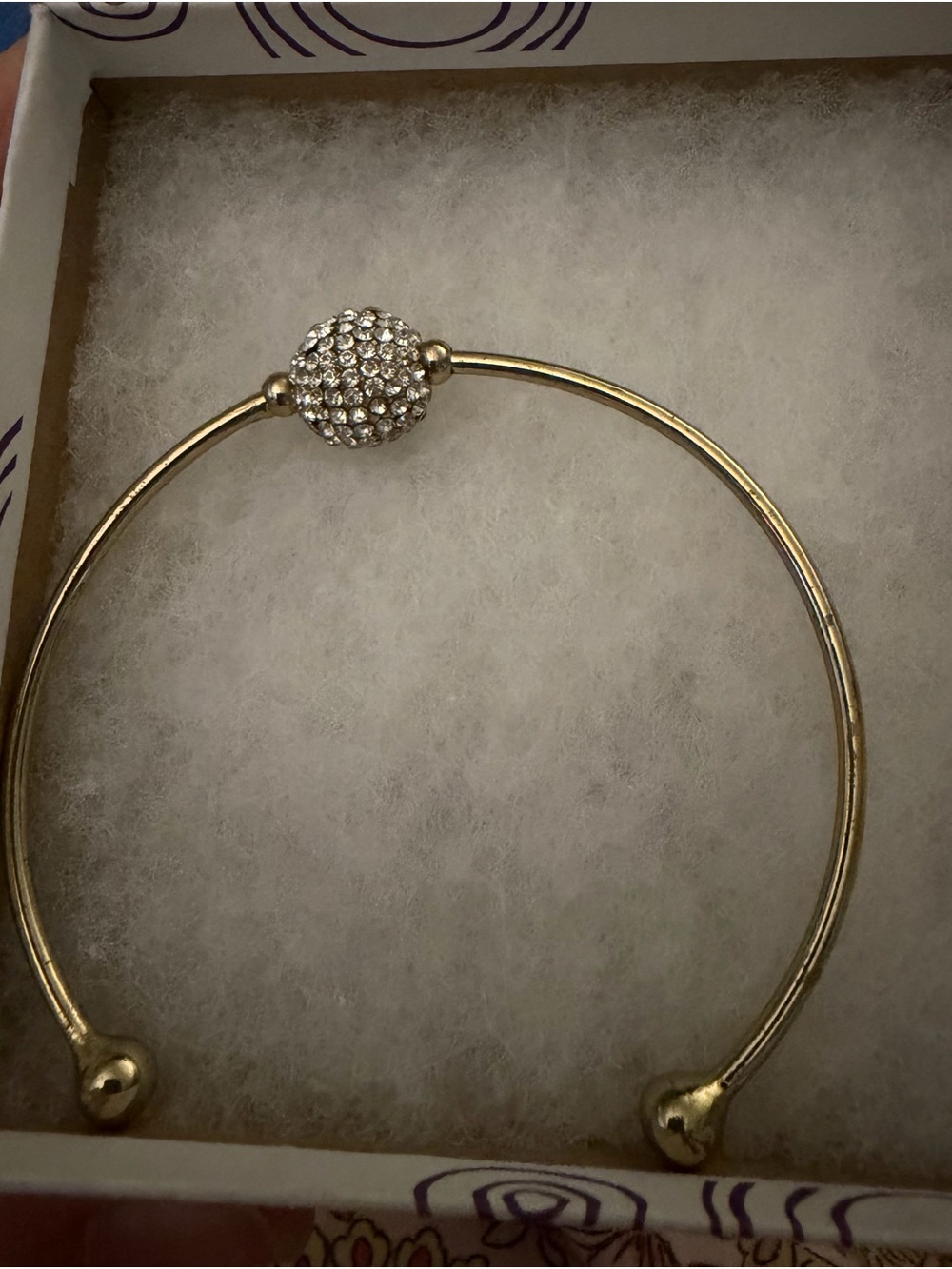 Hallmark Gold Tone Cuff Bracelet with Spinning Rhinestone Ball